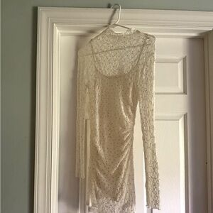 Beautiful white lace with crystal mini dress. Never worn.
